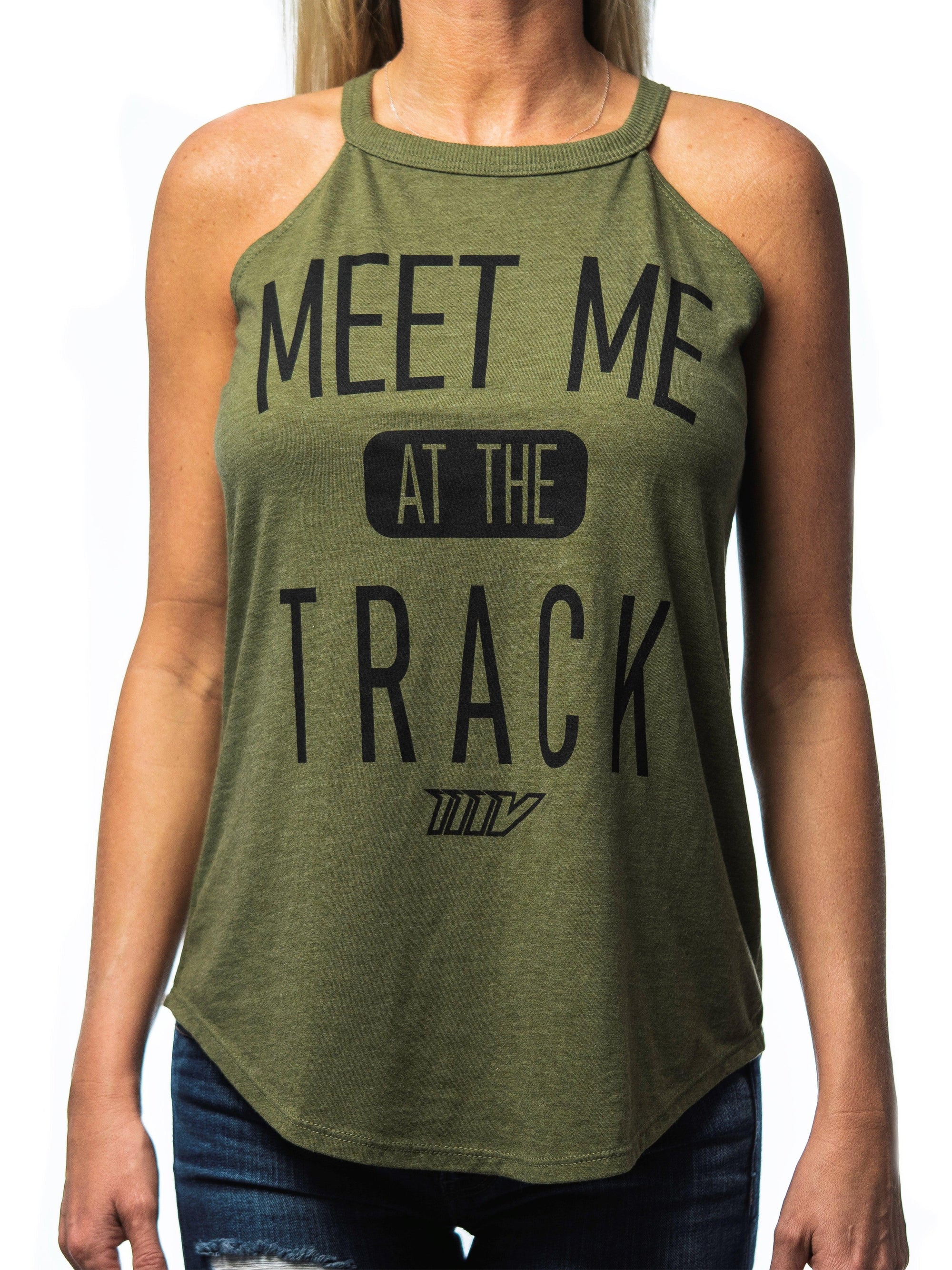 Front view of woman wearing a green tank top that says “MEET ME AT THE TRACK”
